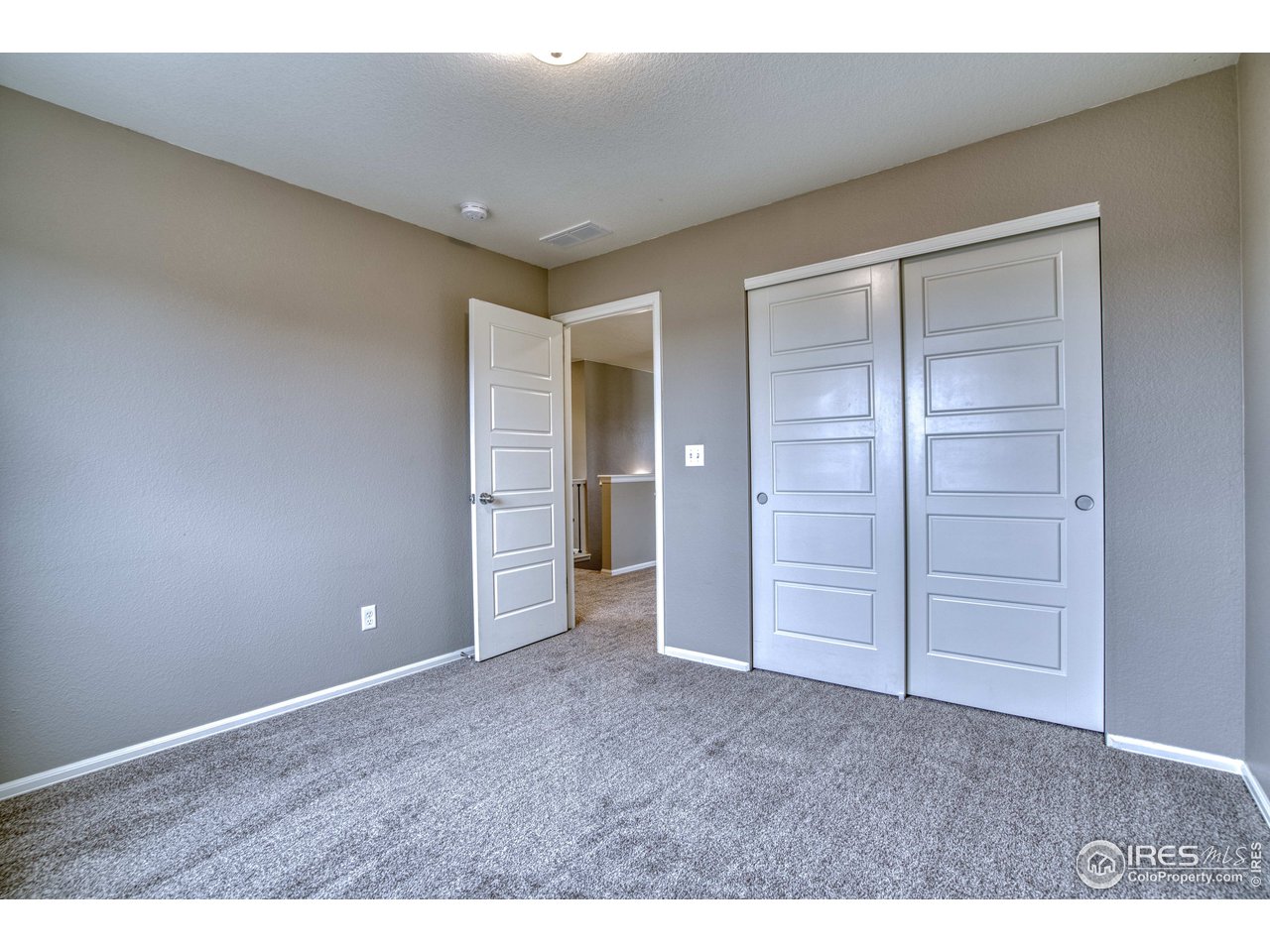 8552 Raspberry Drive Frederick, CO 80504 - Photo 28 of 40 a view of an empty room and closet area