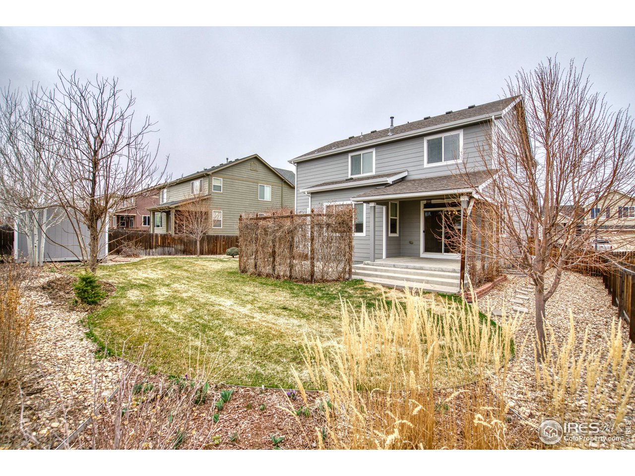 8552 Raspberry Drive Frederick, CO 80504 - Photo 36 of 40 a front view of a house with a yard