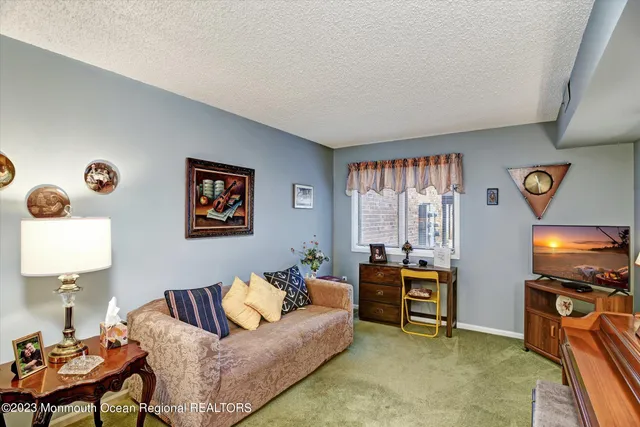 a bathroom with a sink a toilet and shower curtain