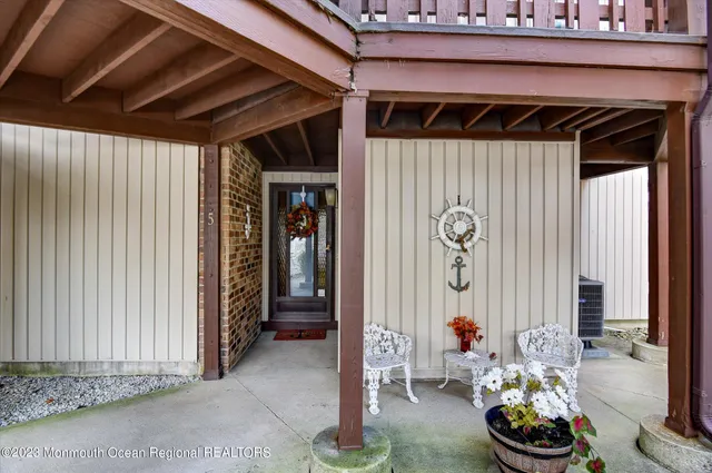 a view of a dry yard with wooden fence
