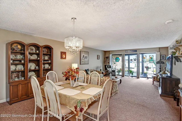 a living room with furniture window and flat screen tv