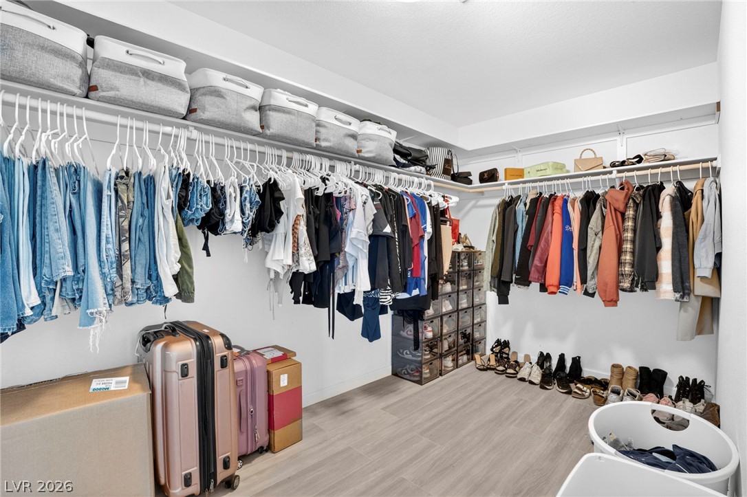 6281 Angora Peak Lane Las Vegas, NV 89115 - Photo 21 of 34 Ample hanging space and shelving create an organized and versatile closet system.