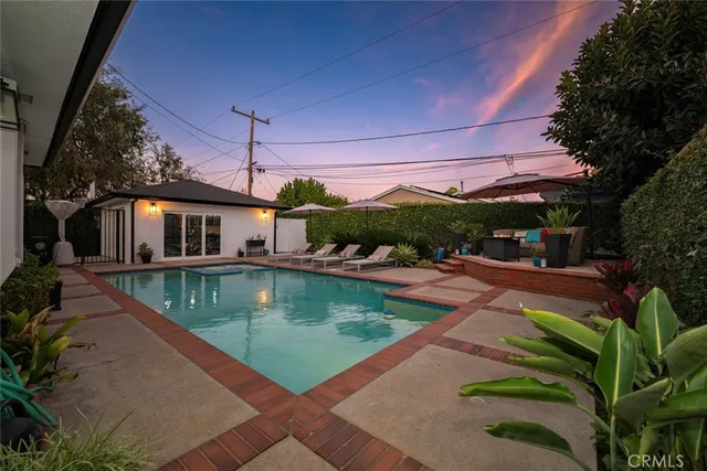 a view of a swimming pool with a patio