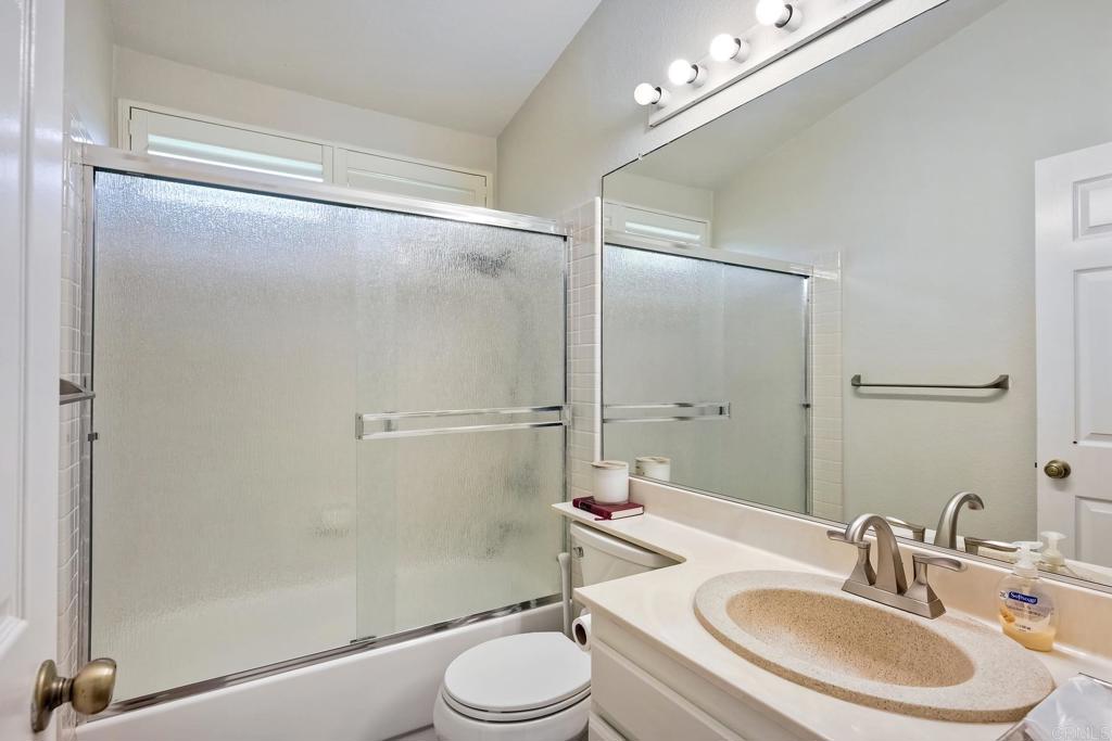 3730 Via Del Rancho Oceanside, CA 92056 - Photo 17 of 22 a bathroom with a sink toilet and shower