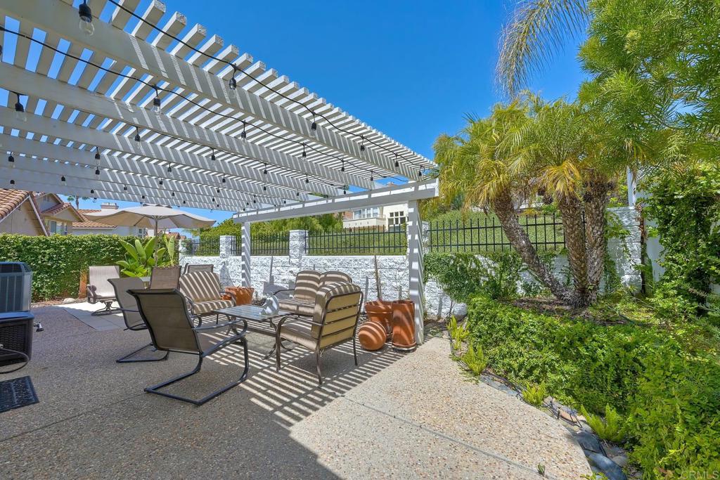 3730 Via Del Rancho Oceanside, CA 92056 - Photo 20 of 22 a backyard of a house with a garden and outdoor seating