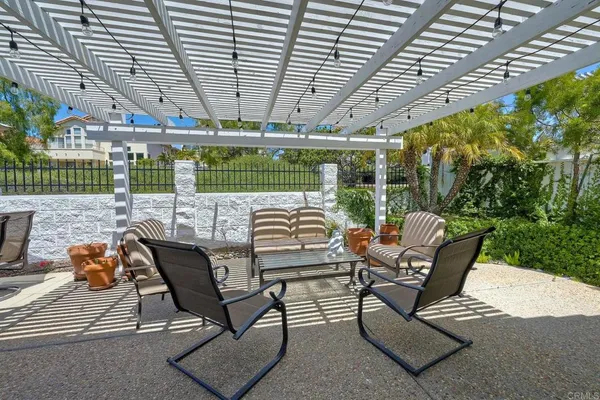 a view of a chairs and table in patio