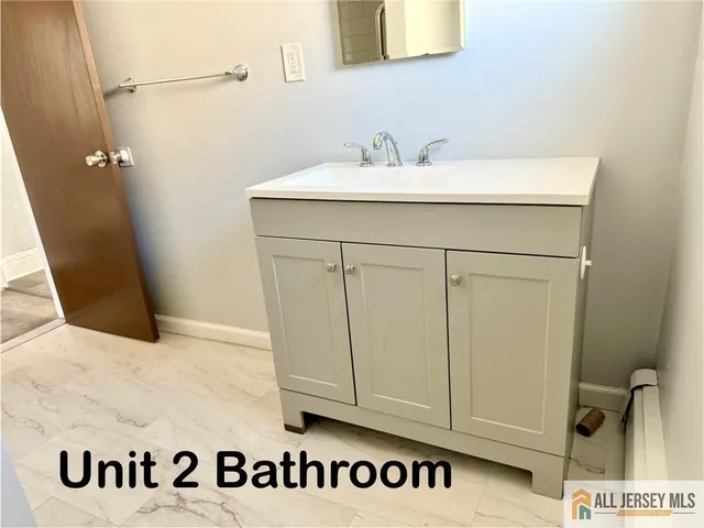 a bathroom with a bathtub sink and toilet