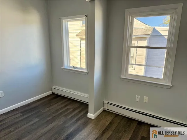 a view of front door with wooden floor