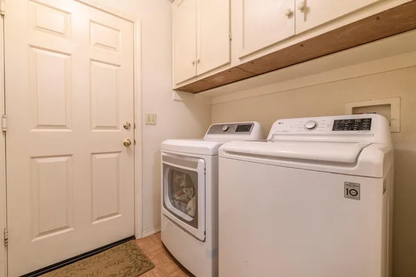 a utility room with dryer and washer