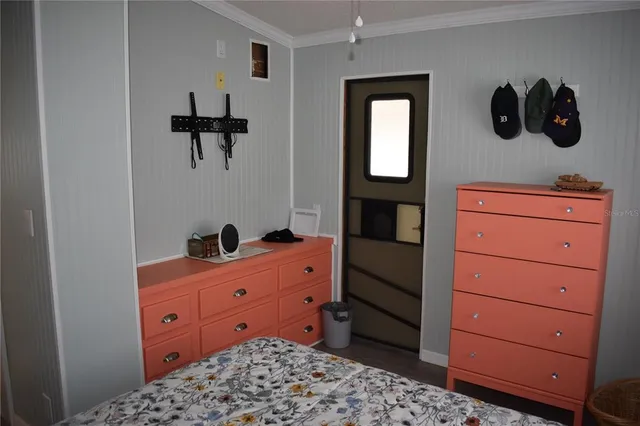 a room with a dresser and a mirror