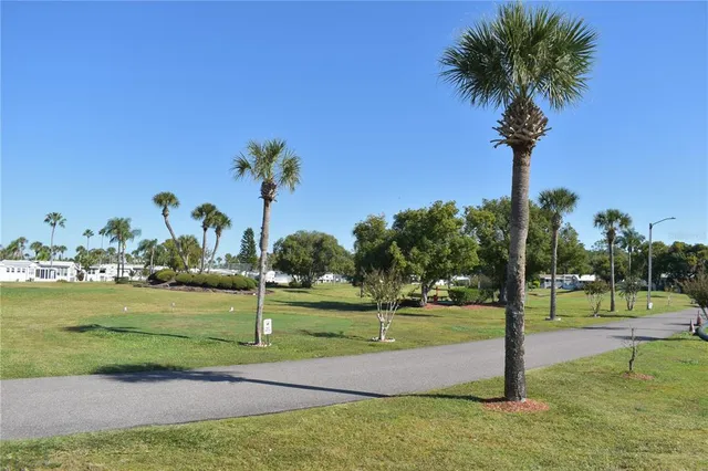 a view of a golf course with a lake