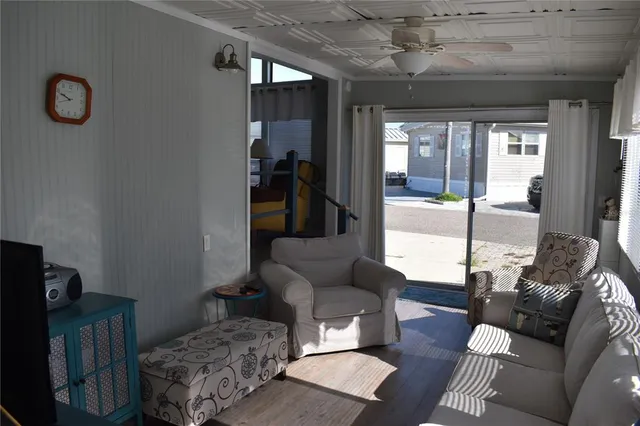 a living room with furniture and a window