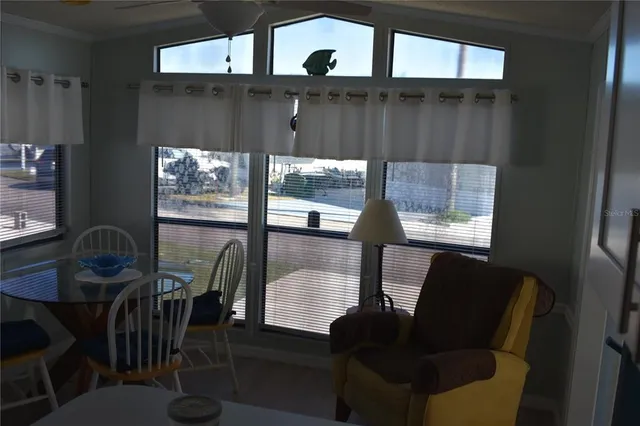 a view of a livingroom with furniture and window