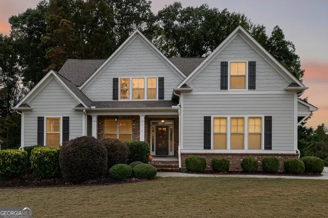 a front view of a house with a yard