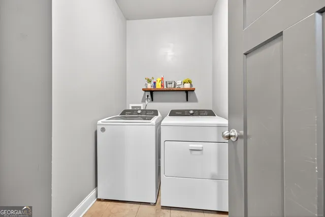a en suite bathroom with a granite countertop sink and a mirror
