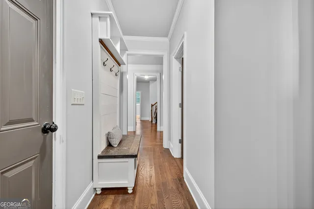 a en suite spacious bathroom with a double vanity sink a large mirror and a bathtub