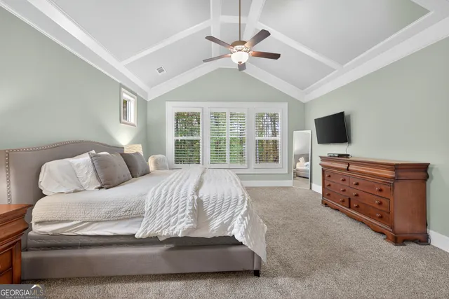 a bathroom with a sink a toilet and a window