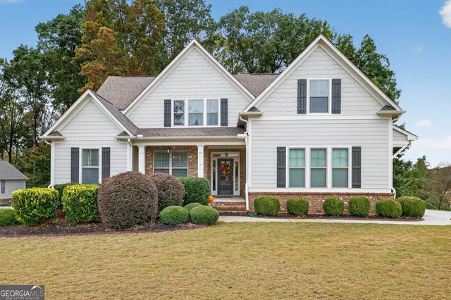 a front view of a house with swimming pool