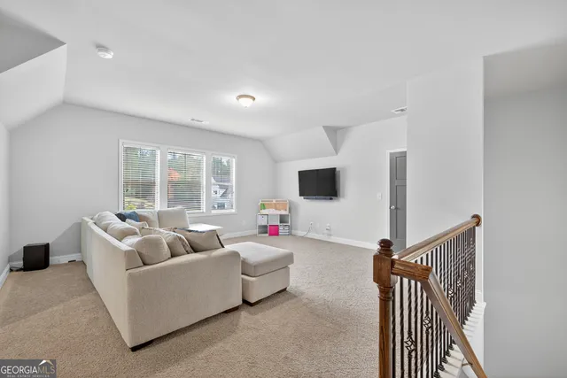 a kitchen with stainless steel appliances kitchen island granite countertop a refrigerator and a sink