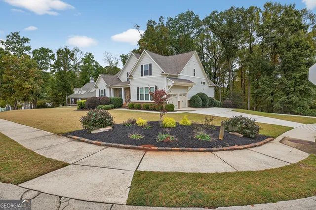 a front view of a house with garden