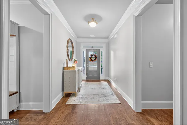 a living room with fireplace furniture and a flat screen tv