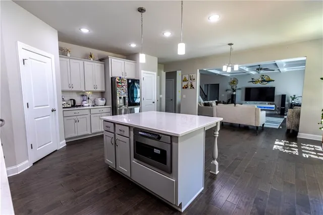 a kitchen with stove and cabinets