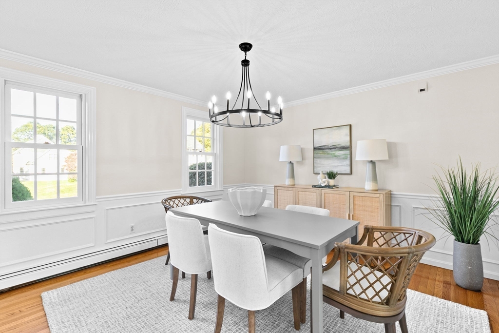 2 Windward Lane Scituate, MA 02066 - Photo 12 of 42 a dining room with furniture a chandelier and window