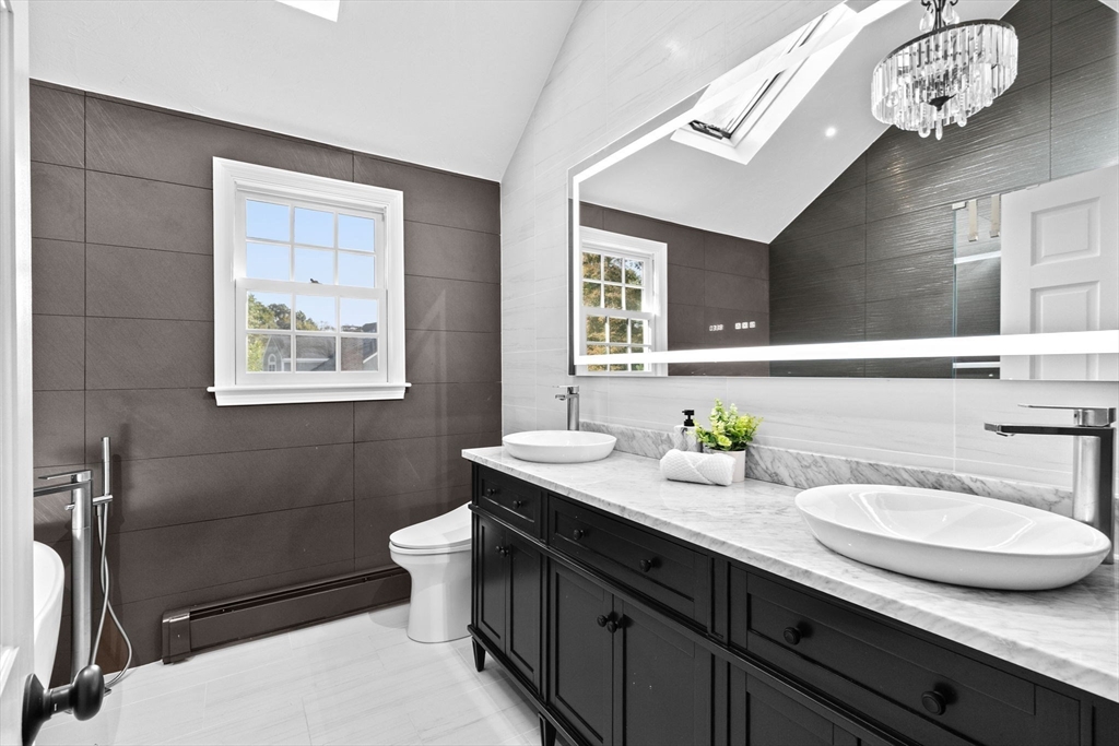 2 Windward Lane Scituate, MA 02066 - Photo 24 of 42 a bathroom with a sink double vanity and a toilet