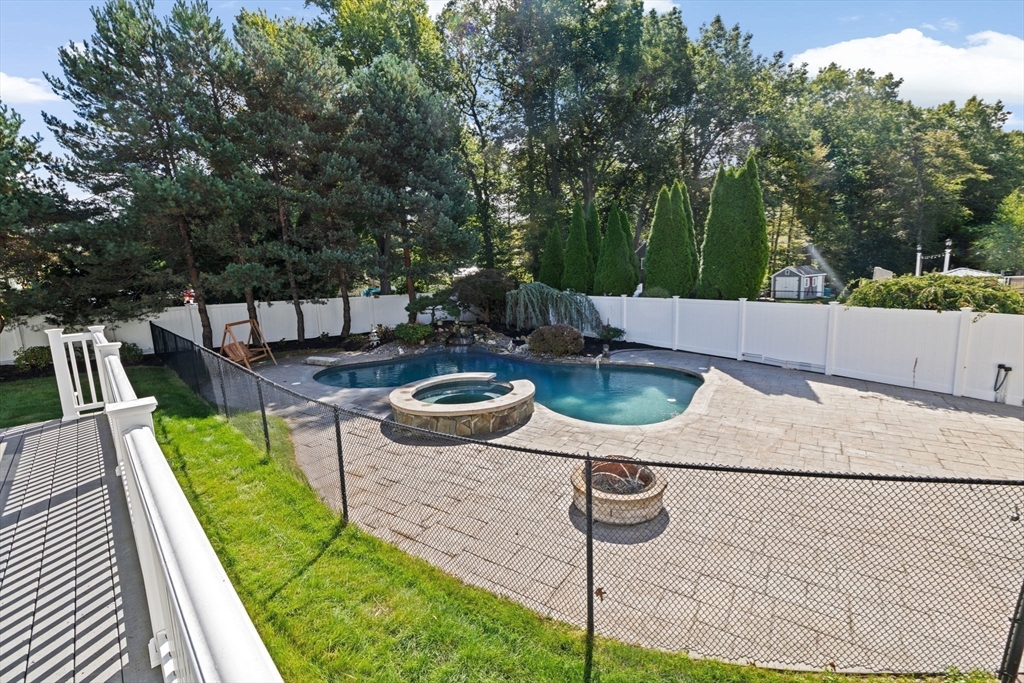 2 Windward Lane Scituate, MA 02066 - Photo 32 of 42 a view of a swimming pool with patio