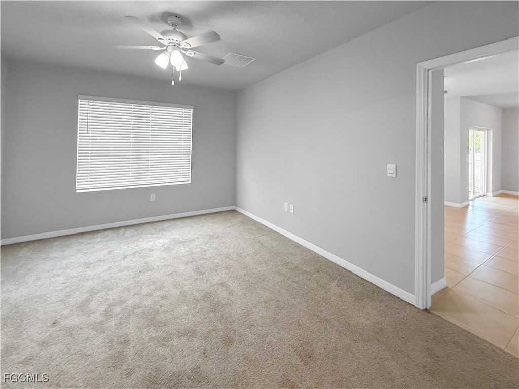 8357 Matanzas Road Fort Myers, FL 33967 - Photo 17 of 25 a view of an empty room with a window