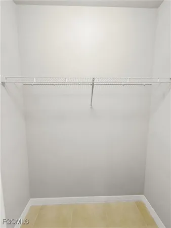 a white toilet sitting next to a white sink