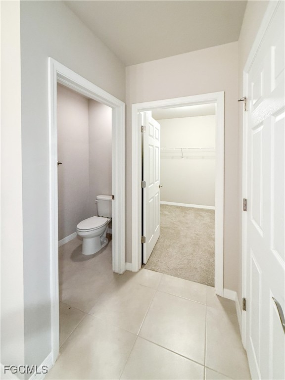 8357 Matanzas Road Fort Myers, FL 33967 - Photo 22 of 25 a bathroom with a granite countertop sink a toilet and a shower