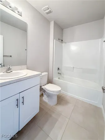 a bathroom with a sink a toilet and a bathtub