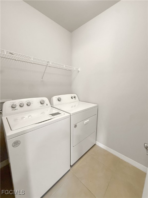 8357 Matanzas Road Fort Myers, FL 33967 - Photo 9 of 25 a utility room with dryer and washer