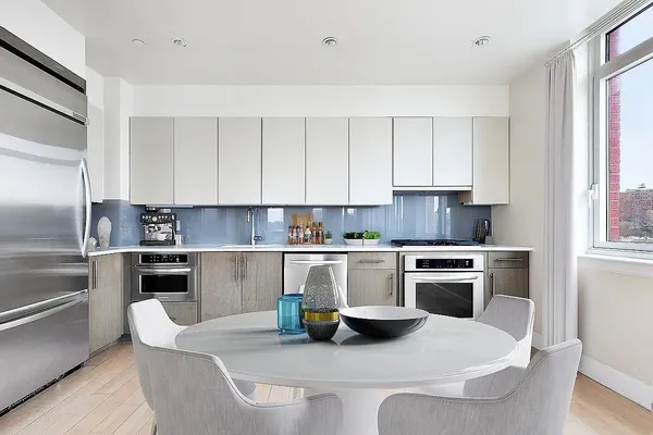 a living room with furniture large window and flat screen tv