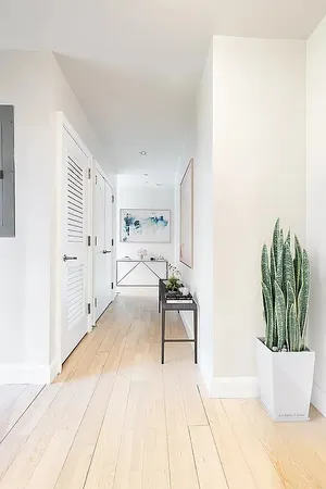 a spacious bedroom with a bed and a couch