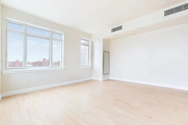 a view of an empty room with a window