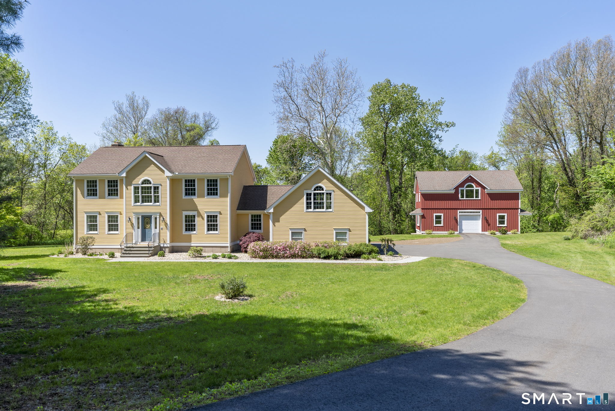 555 Waterville Road Avon, CT 06001 - Photo 1 of 40 a front view of a house with a yard