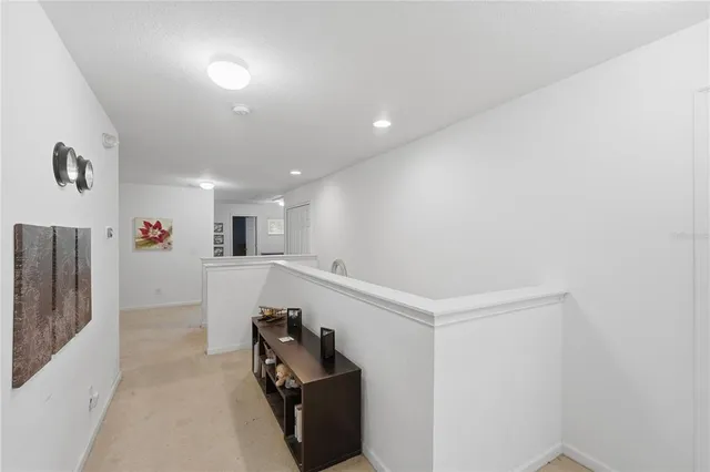 a view of a hallway with workspace