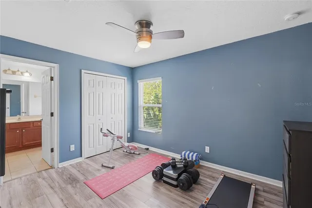 a bed room with a bed and a window