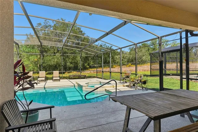 a view of a chairs and table in the patio