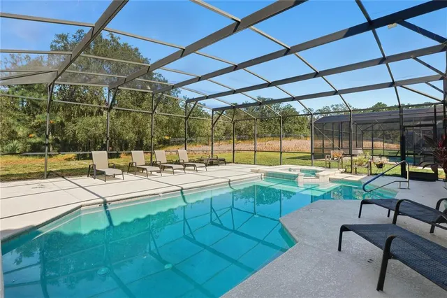 a view of a swimming pool with a patio