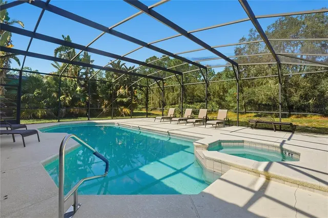 a view of a swimming pool with a patio