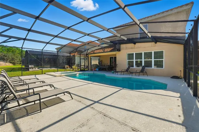 a view of a backyard with sitting area