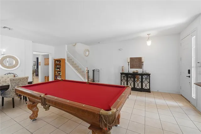 a room with furniture and air hockey table