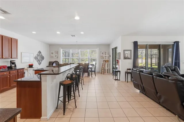 a large dining hall with stainless steel appliances lots of counter top space