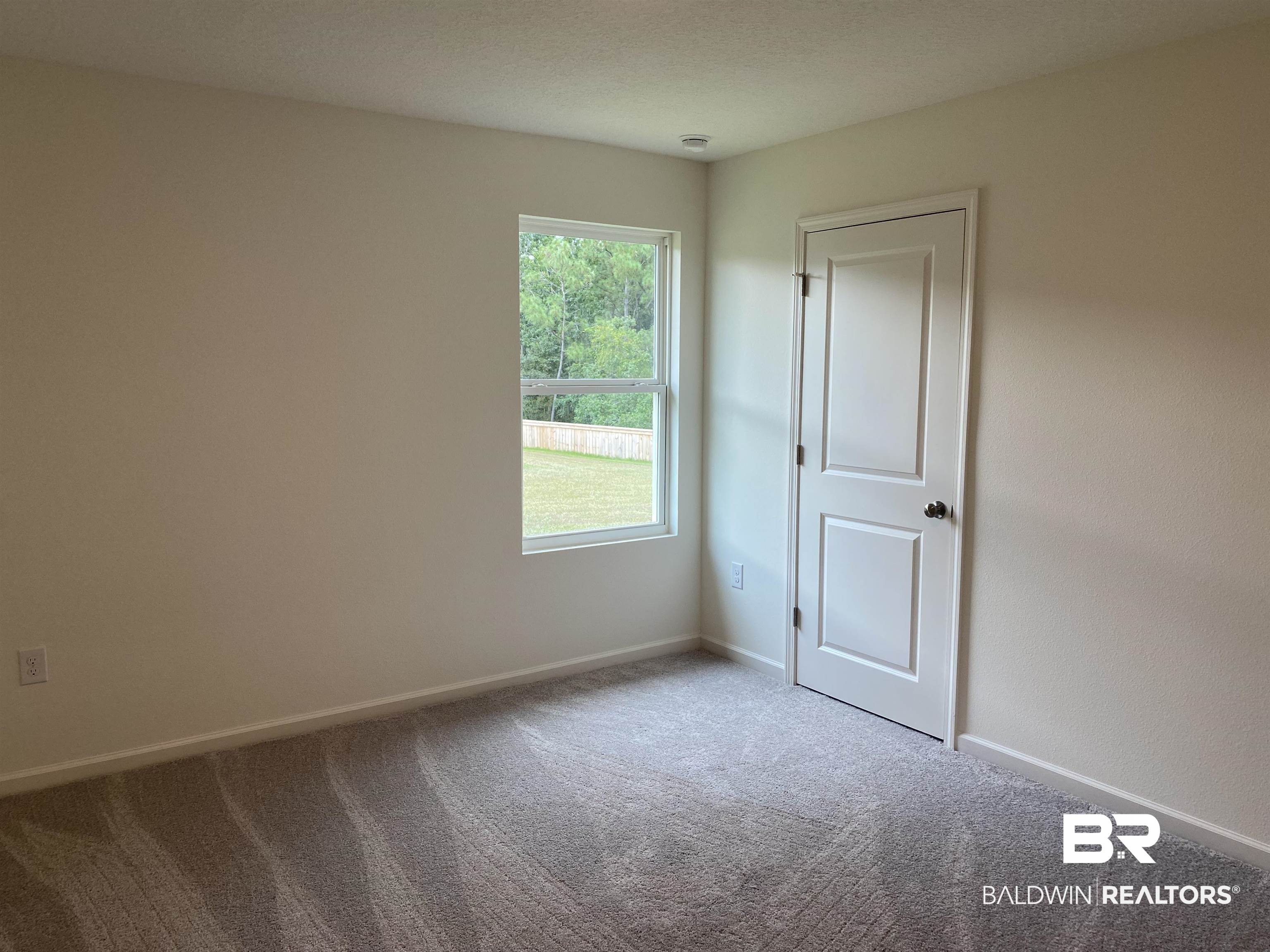 21676 Yosemite Boulevard Fairhope, AL 36532 - Photo 7 of 19 Spare room featuring carpet floors