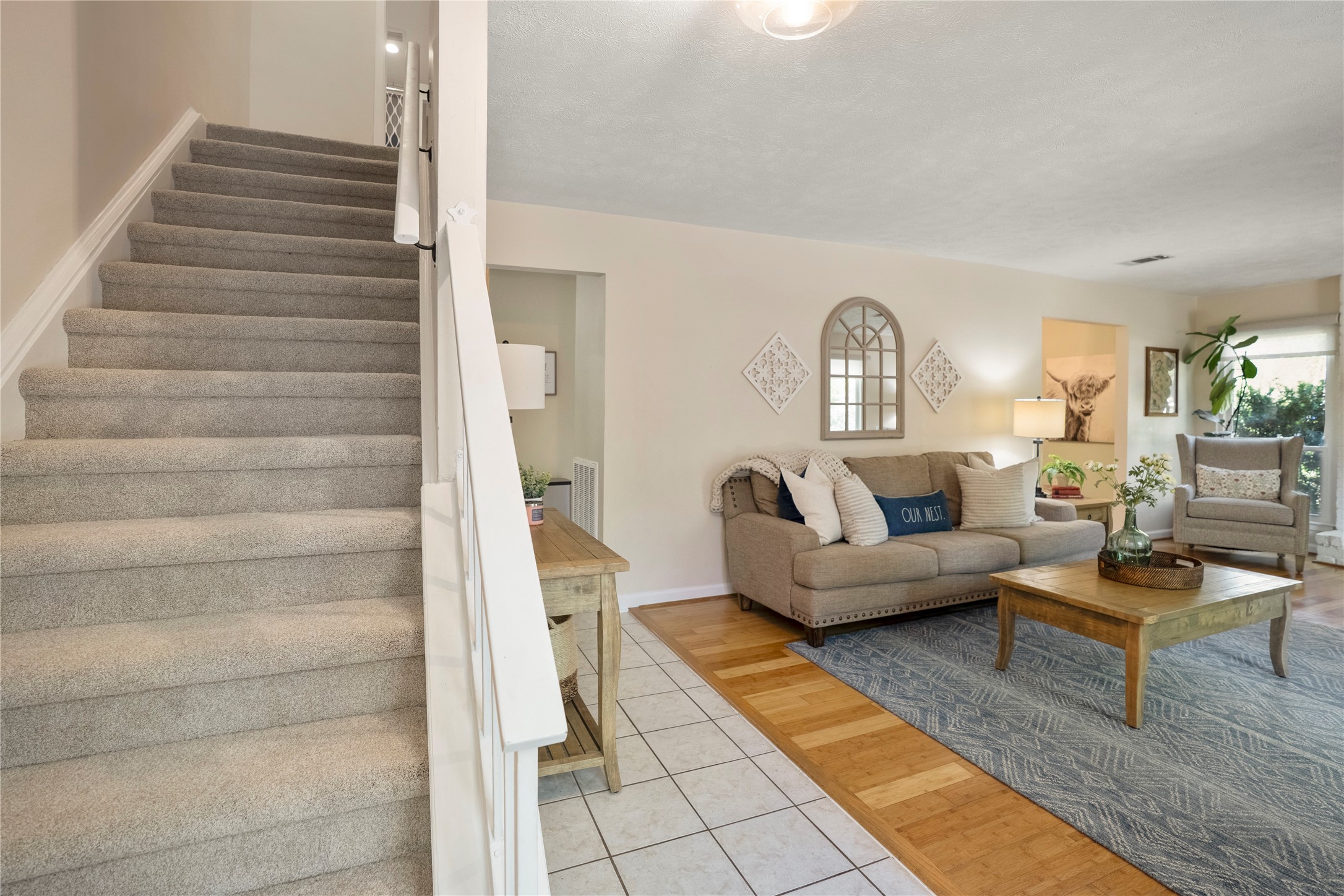 12224 Gun Oak Place Spring, TX 77380 - Photo 23 of 42 Central staircase connecting both levels, creating a natural flow between living and private spaces.