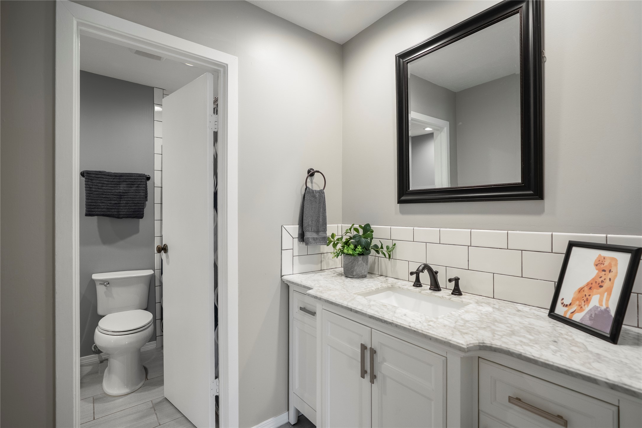 12224 Gun Oak Place Spring, TX 77380 - Photo 28 of 42 Well-designed bathroom with extended counter space and storage for functionality and ease.