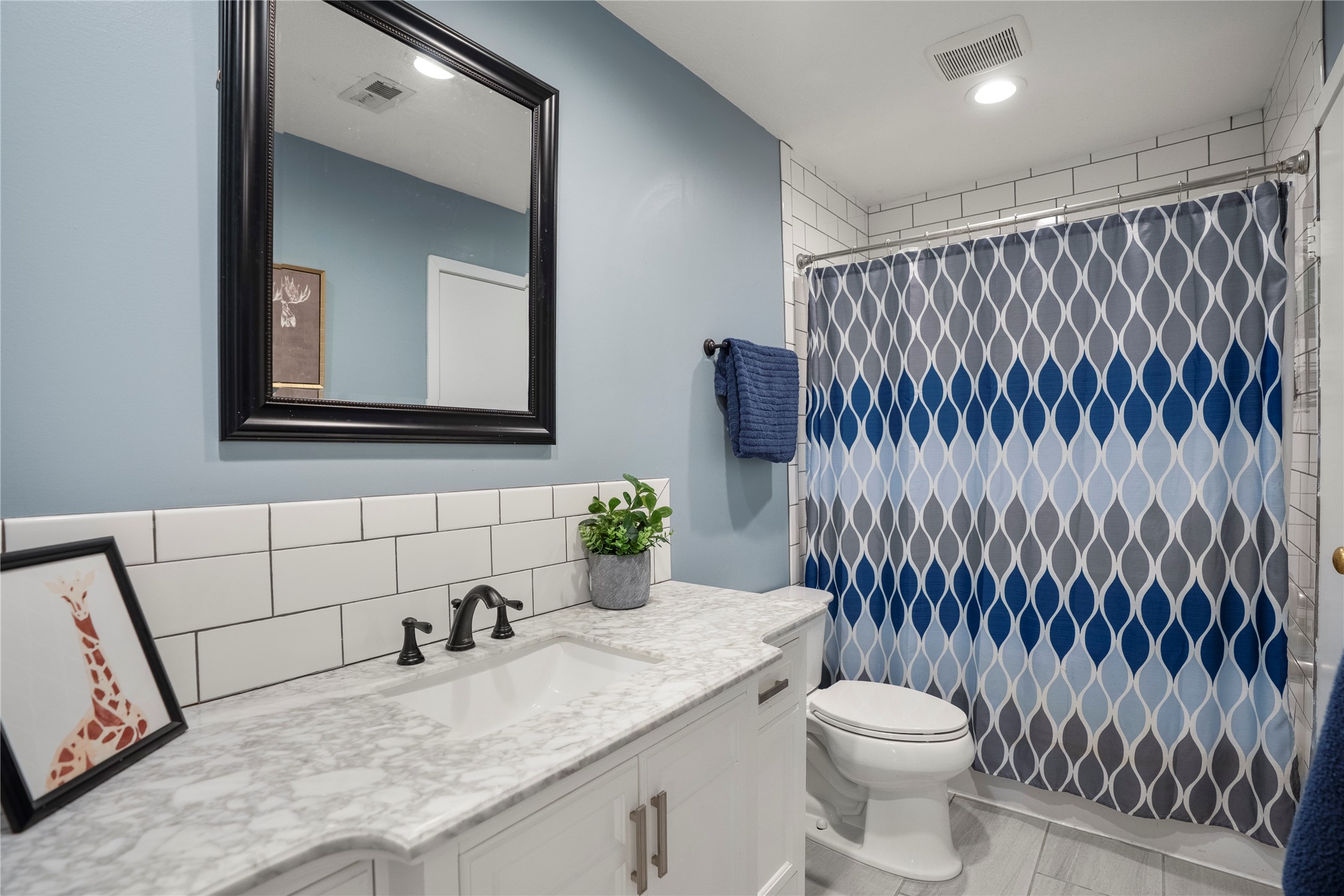 12224 Gun Oak Place Spring, TX 77380 - Photo 29 of 42 Full bathroom with a clean, classic layout supporting both daily routines or guests.